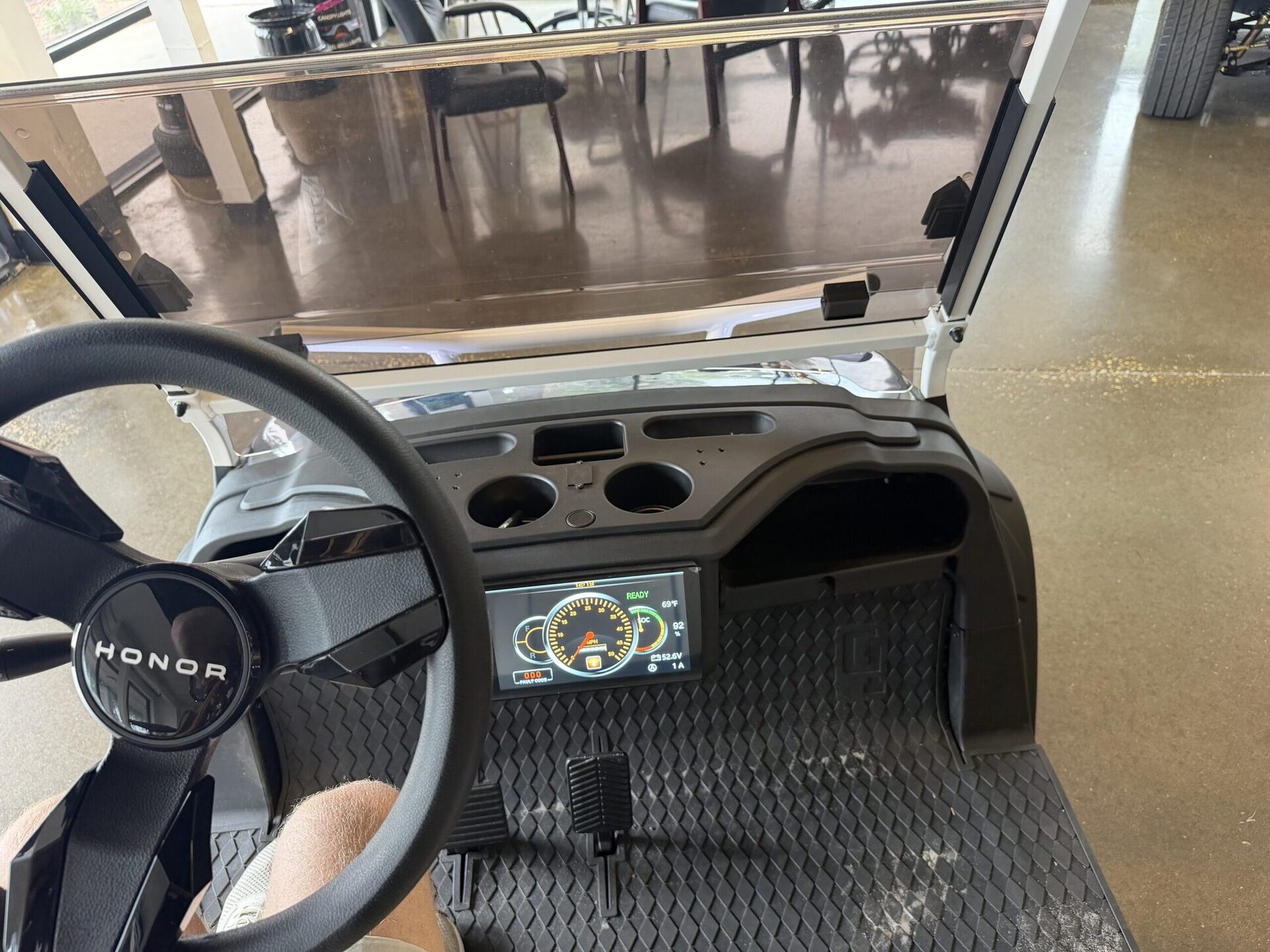 HONOR golf cart steering wheel and lit gauge dashboard from the driver's seat